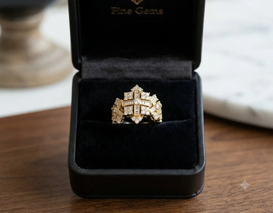 Gold diamond ring in a 'Fine Gems' box on a wooden surface